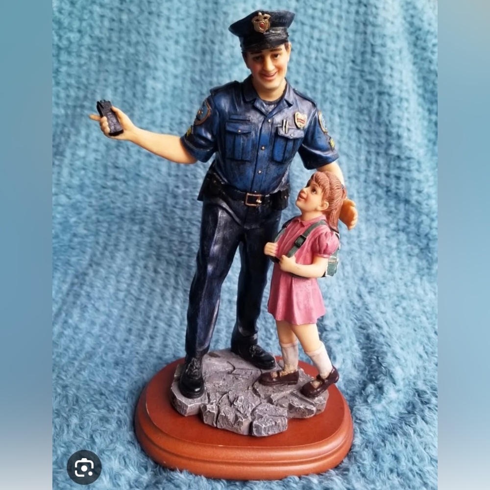 1999 Vanmark Blue Hats of Bravery - A Helping Hand police figurine.